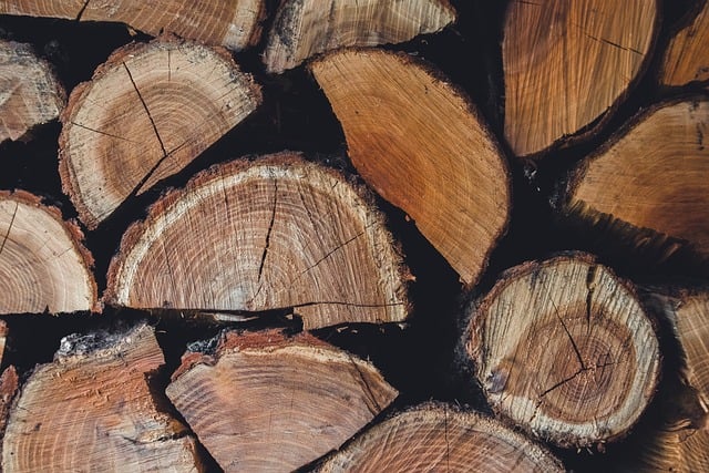 Black HDPE high density polyethylene pipes large diameter stacked on timber on a construction site