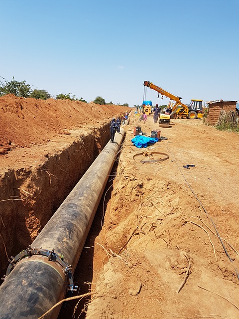 Construction site panorama with pipe installation in progress