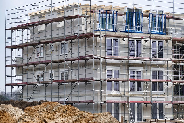 Galvanised steel scaffolding and construction pipes stacked outdoors on a building site